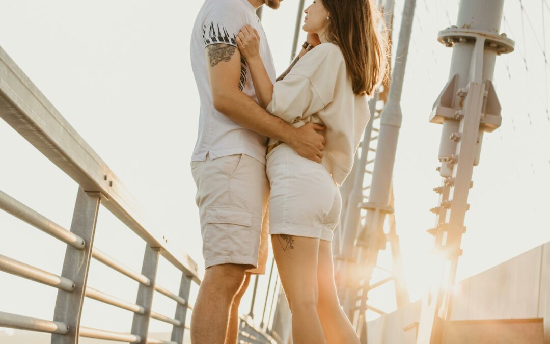 Cute couple hugging on bridge